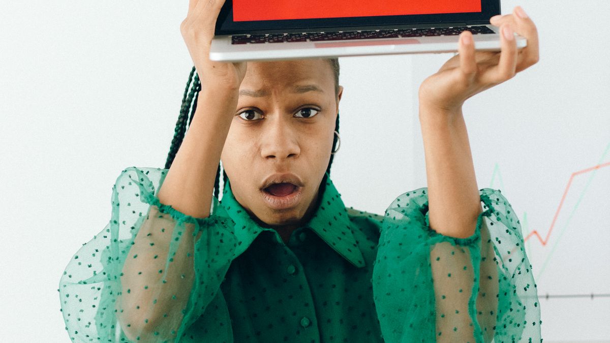 Person reviewing a suspicious email on a laptop